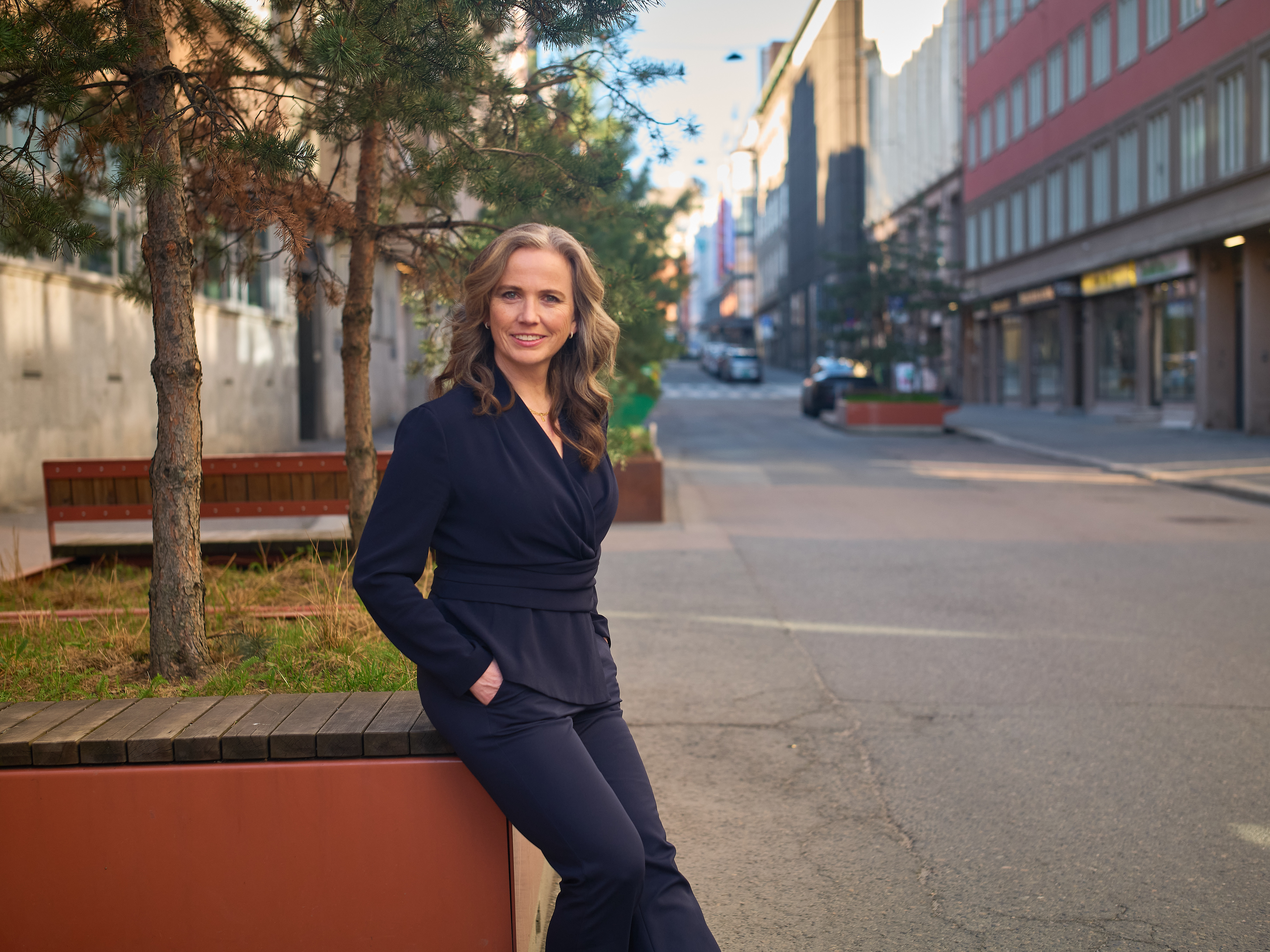 Asta Ellingsen Stenhagen smiles at the camer on a street in Oslo. 