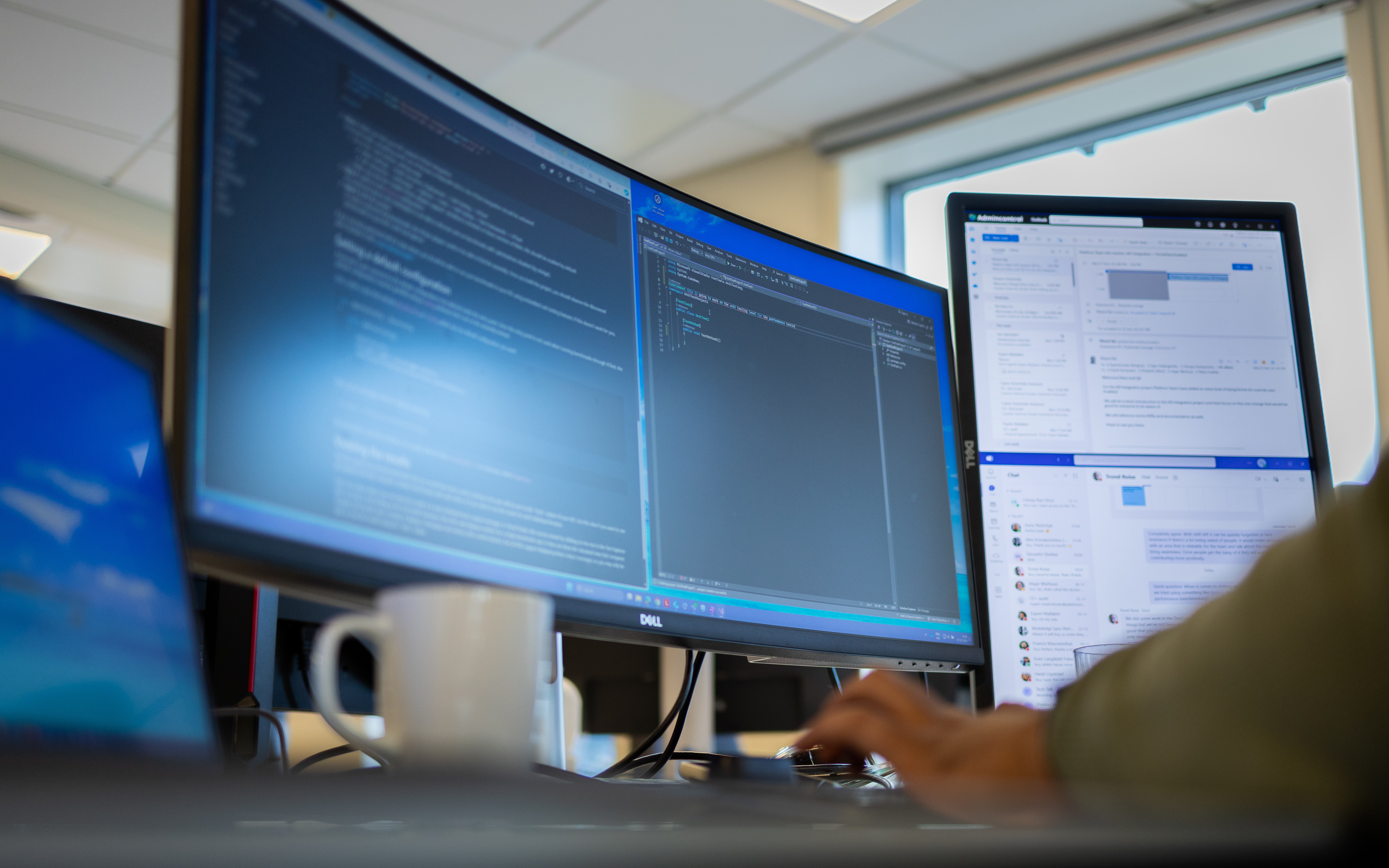 A person works on code on their computer screen.